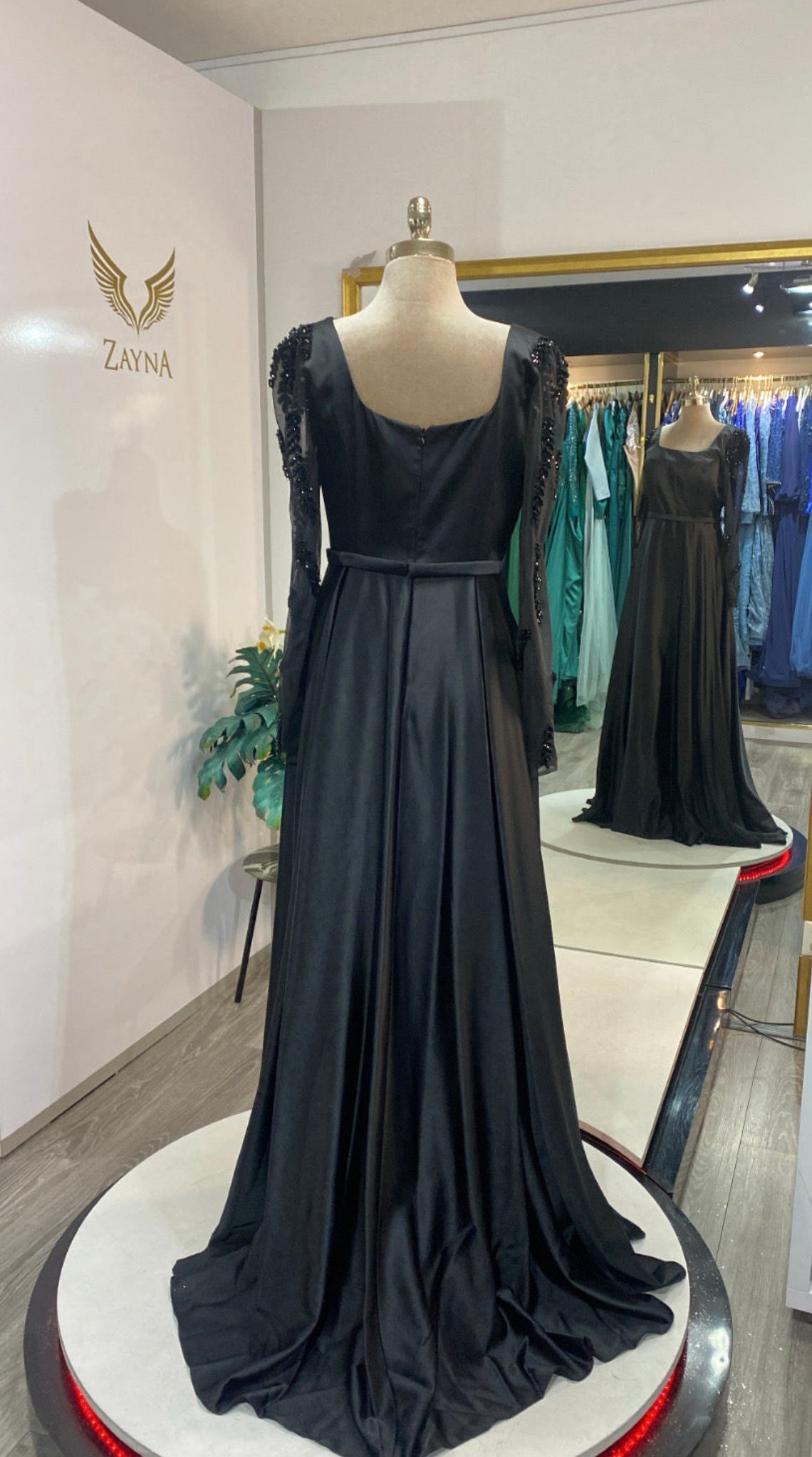 Elegant black dress with satin finished sleeves with beads