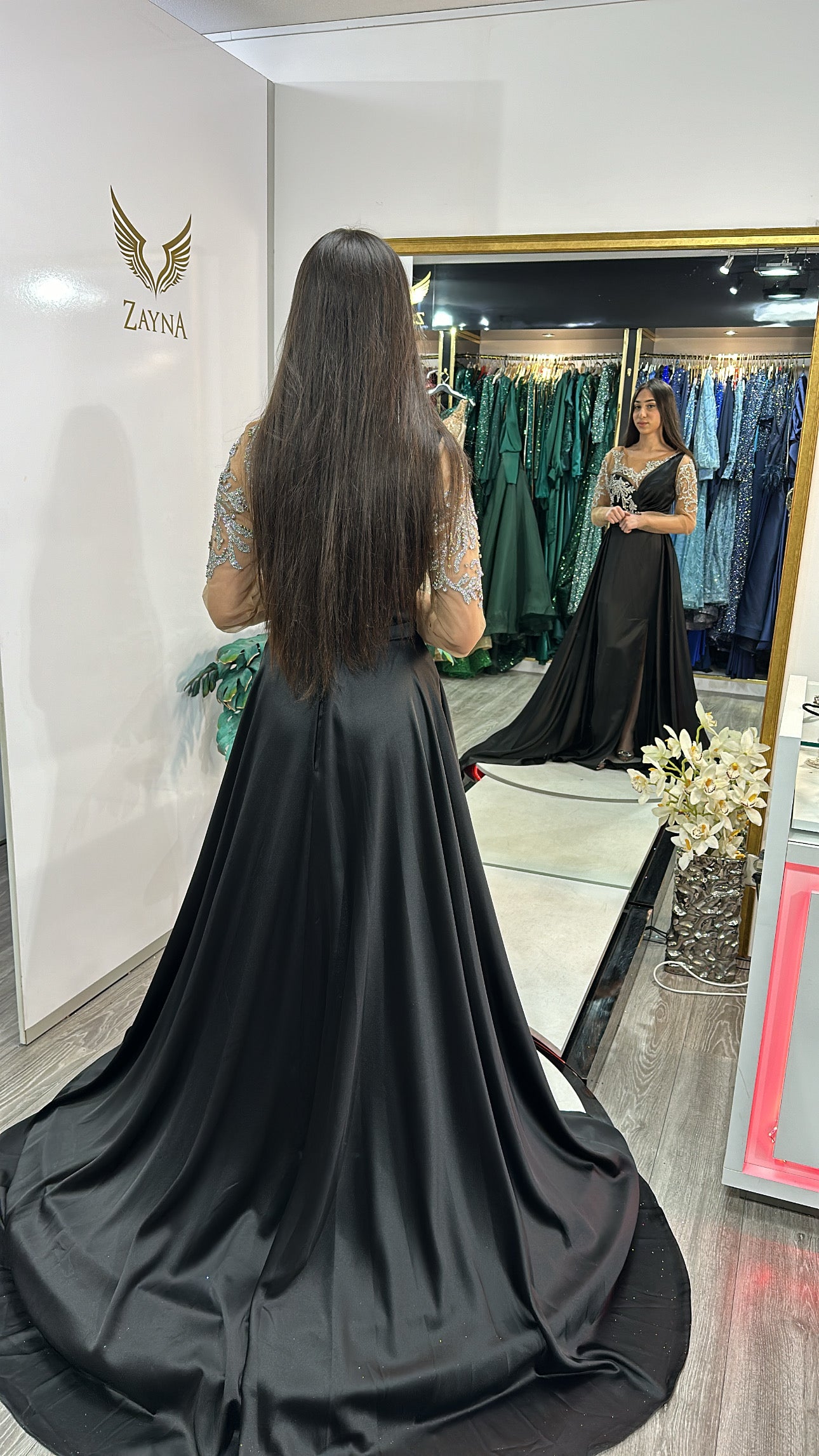 Elegant black dress with long train
