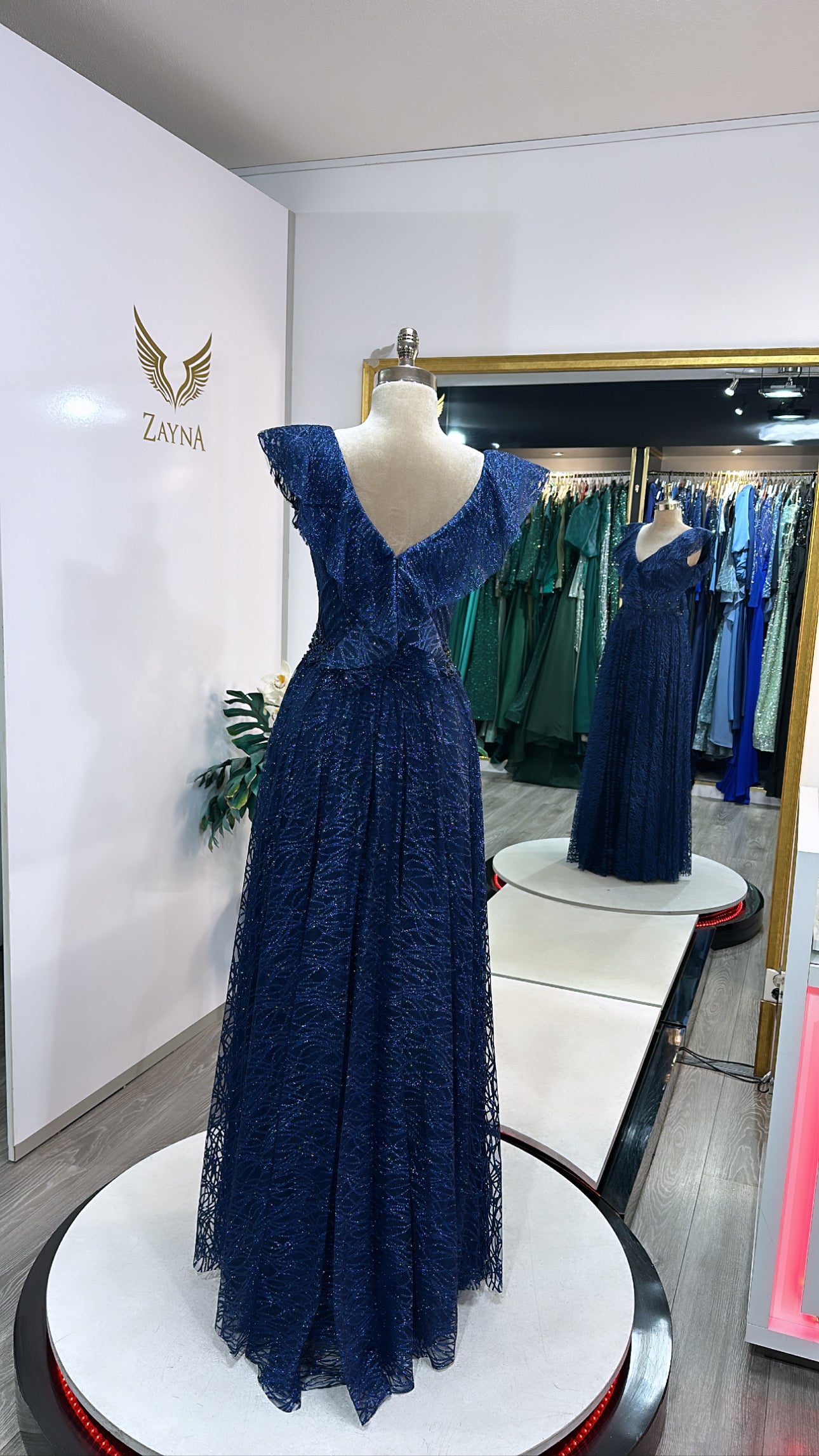 Elegant dark blue dress decorated with beads