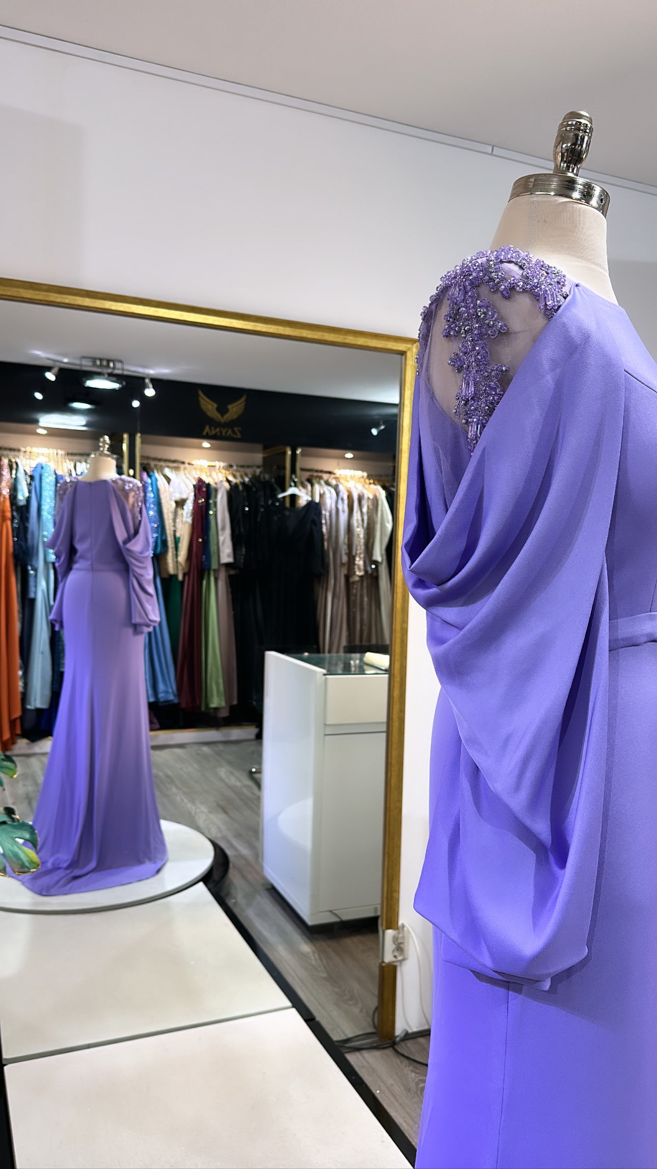 Elegant purple dress decorated with beads, split