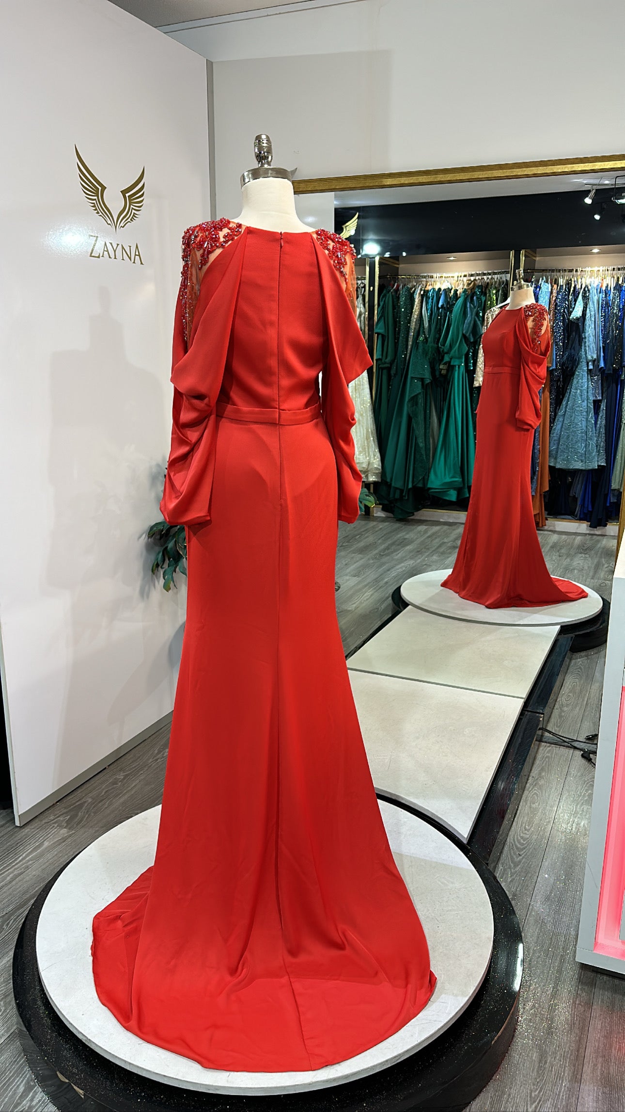 Elegant orange dress decorated with sleeves, split