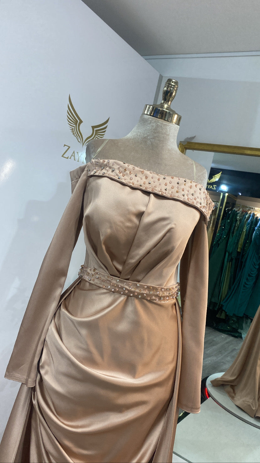 Elegant gold dress decorated with beads and train