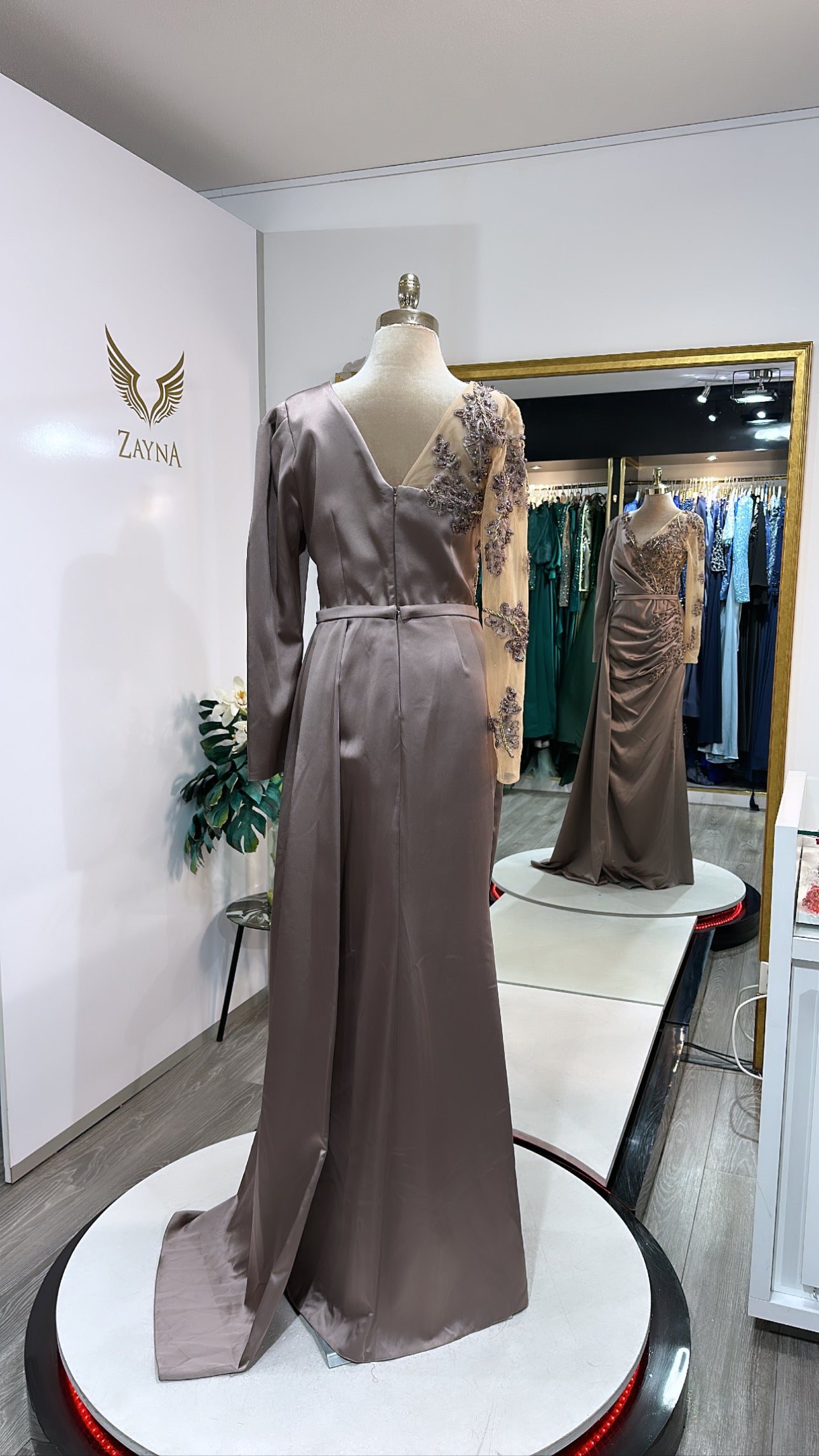 Elegant copper dress decorated with beaded design, satin with split