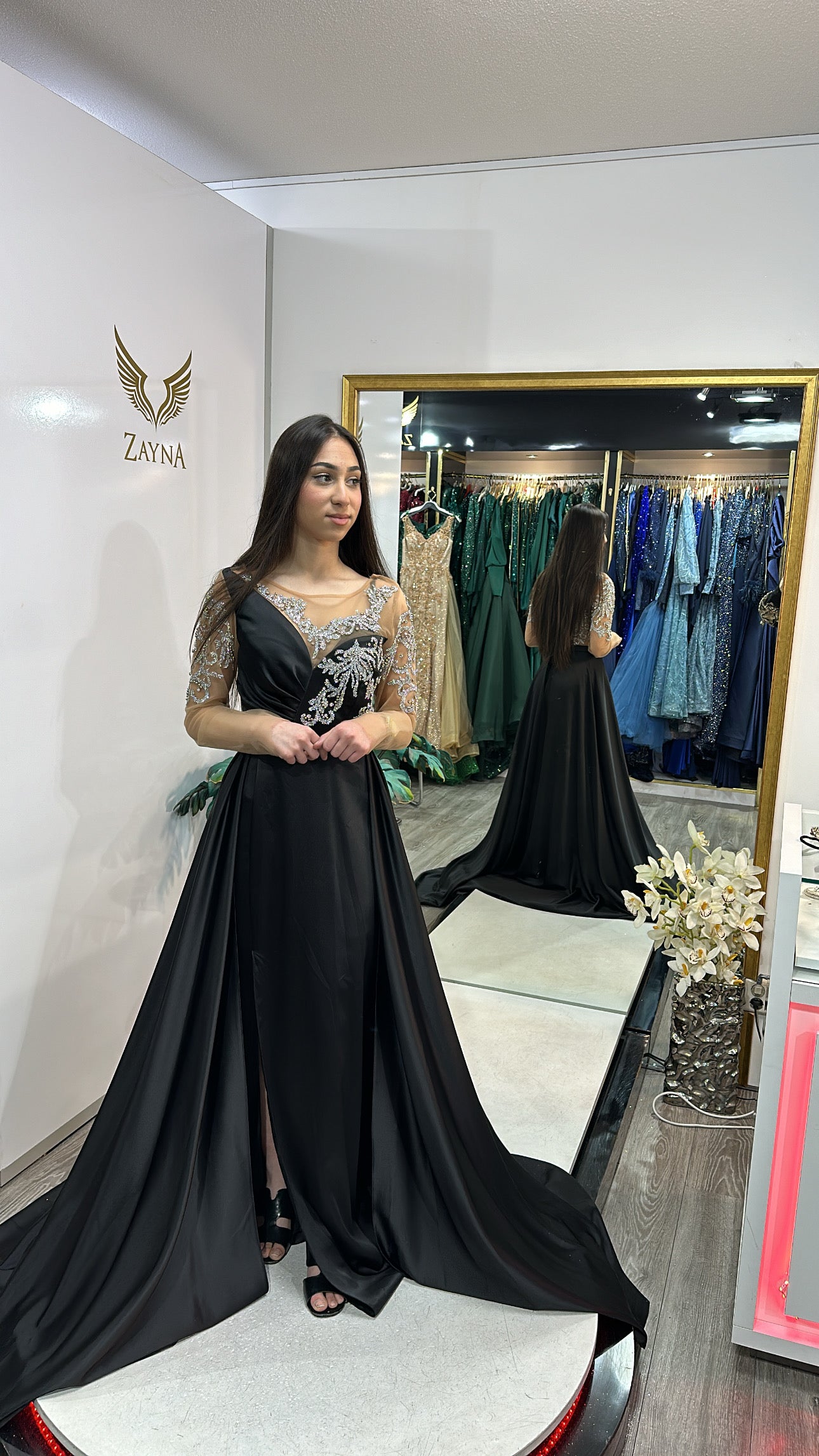 Elegant black dress with long train