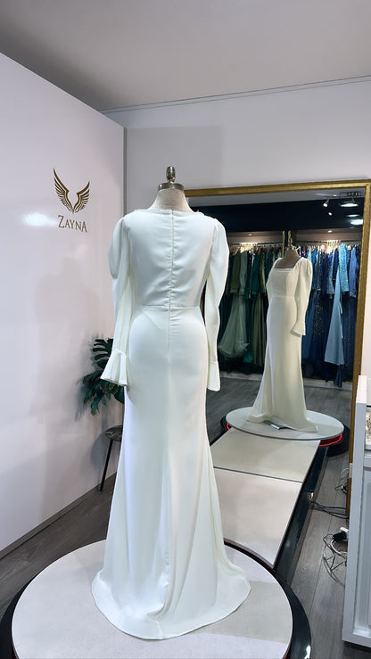 Elegant white dress decorated with beads, nikkah dress