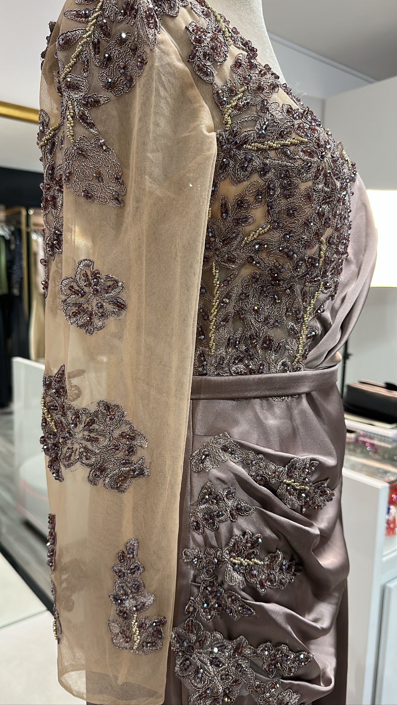 Elegant copper dress decorated with beaded design, satin with split