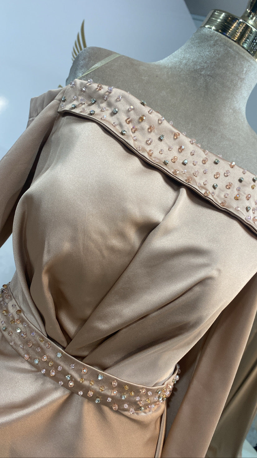 Elegant gold dress decorated with beads and train