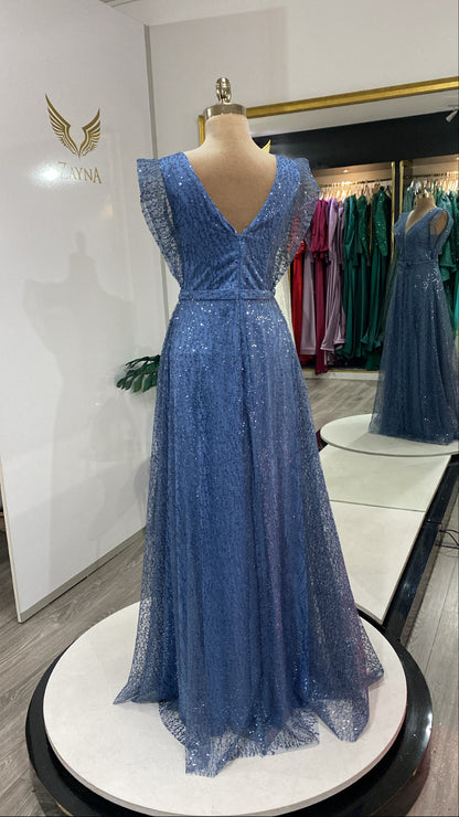 With pearls and glitter blue dress.