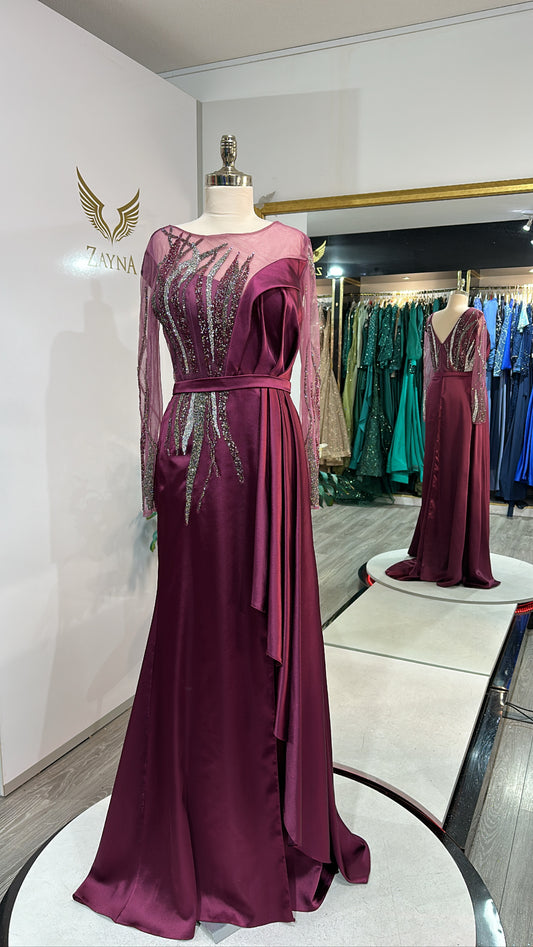 Elegant pink dress decorated with beads, satin